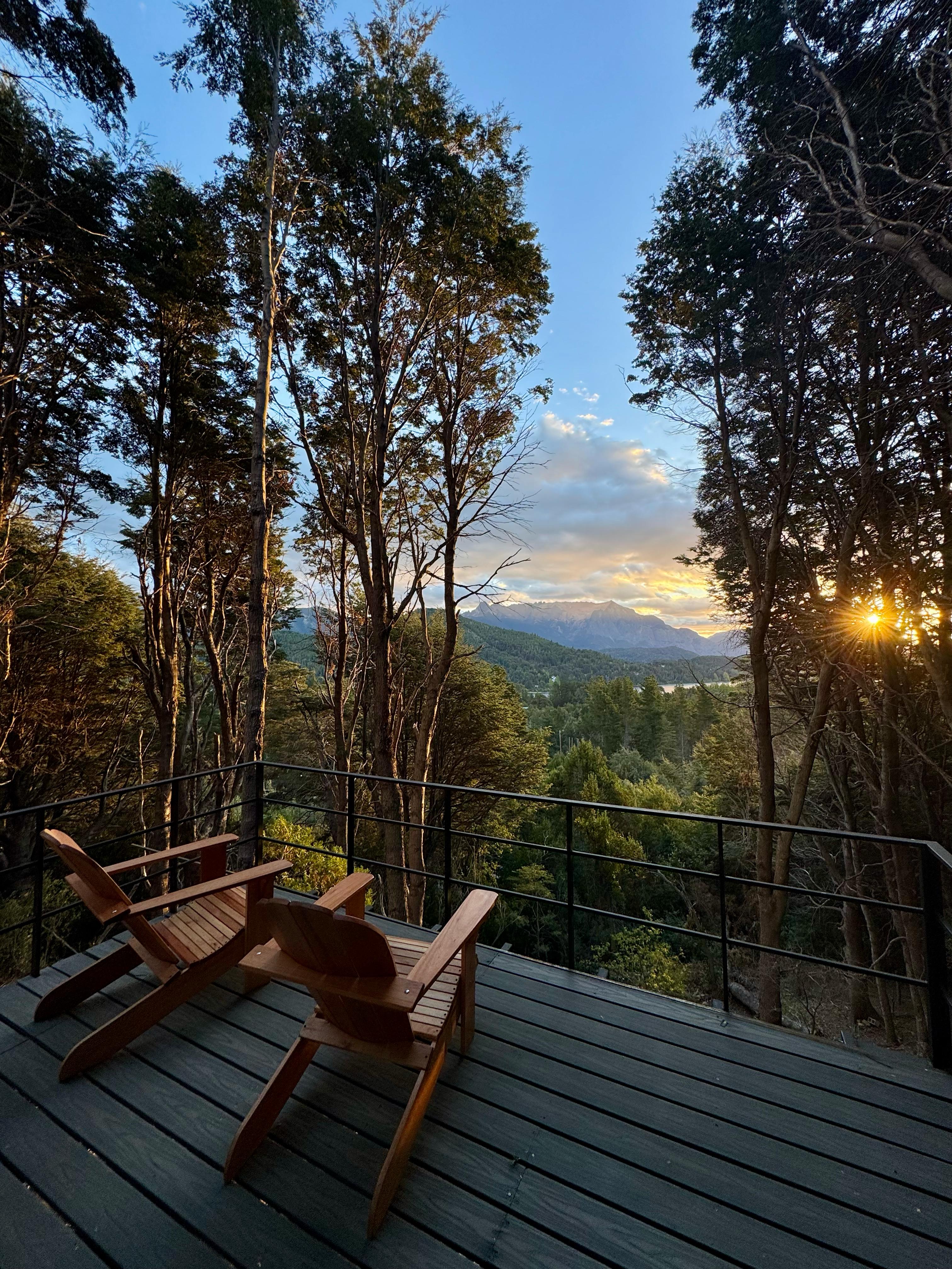 Deck at sunset — Cerro López and Nahuel Huapi beyond the coihue