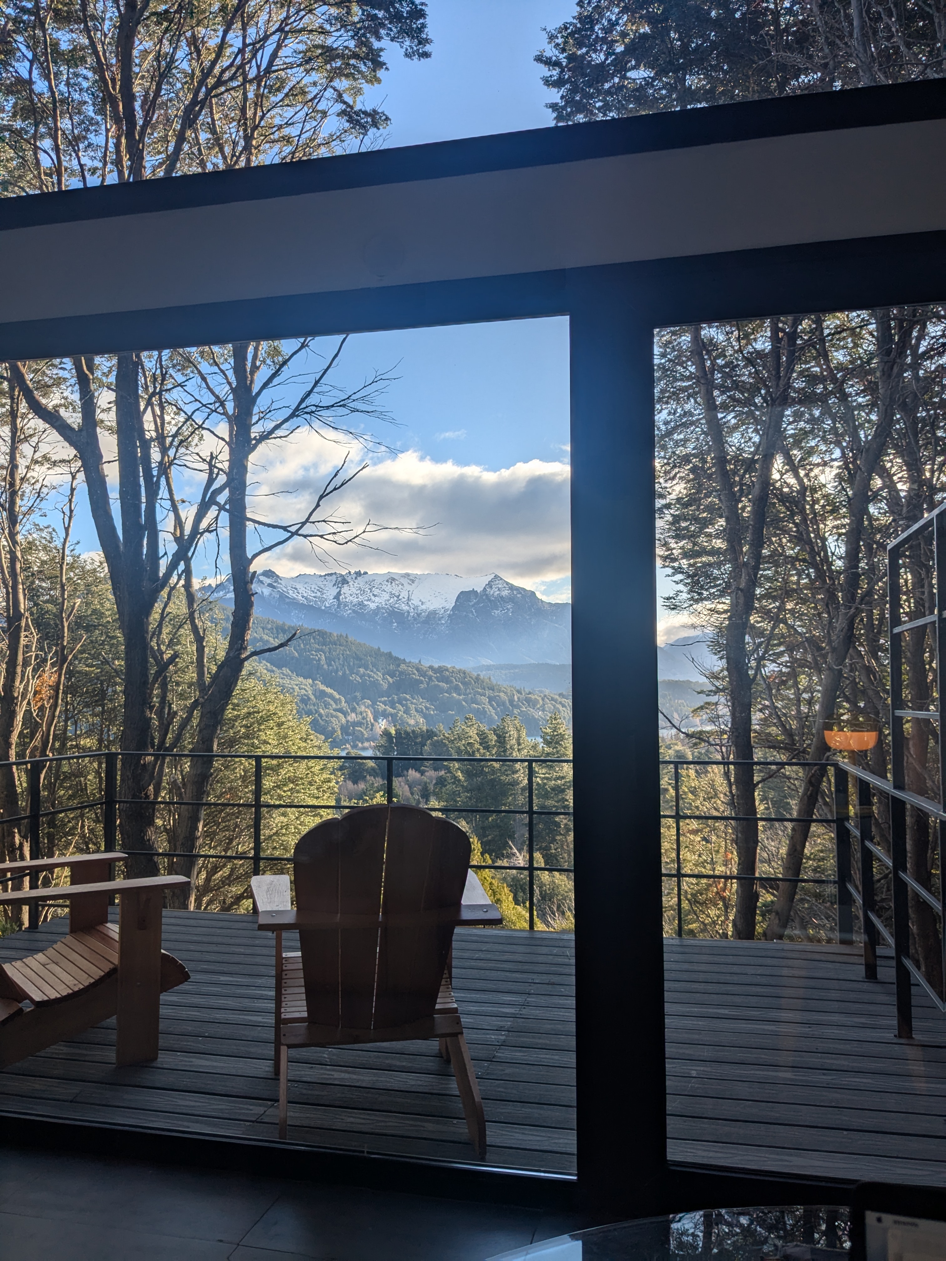 Glass front — Cerro López through the steel frame